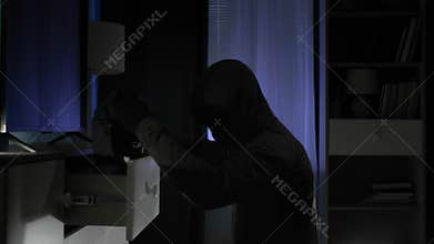 male intruder entered the room at night in search of jewelry and money