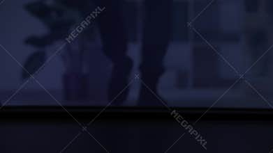 trespassing, male thief sneaking into a room at night, legs close up