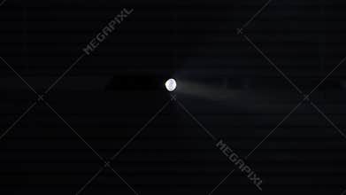 crime and robbery concept, male thief with flashlight looking for help through blinds against police lights background