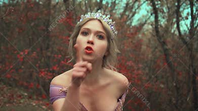 strict princess blonde strictly gives orders pointing finger. Asks everyone to be silent gesture. puts hand to her lips