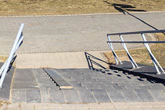 Outdoor stairs with deformed railings. Concept