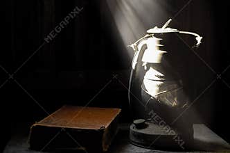 Old lamp and dark wall.