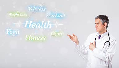 Clinical doctor pointing to health and fitness collection of words