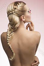 Female with nude back and creative hairdo