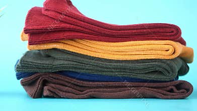 Colorful knit fabrics displayed on a blue background