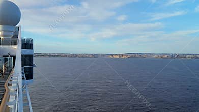 Slow-motion cruise ship approach to Valletta, Malta, with Grand Harbour in view