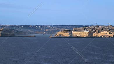 Entrance to Valletta's Grand Harbour with historic fortifications and lighthouses