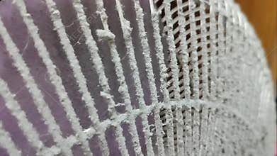 Dust on the front grille of the electric fan.
