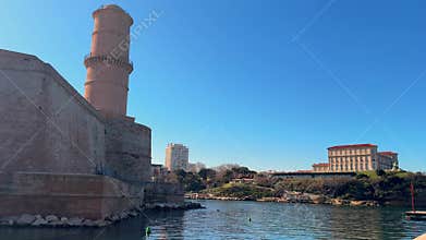 Fort Saint Jean lighthouse and Palais du Pharo across the water in Marseille