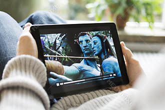 Man watching movie avatar on iPad