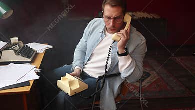 Cinematic vintage writer scene - author on phone