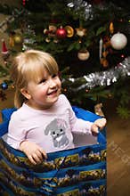 Blonde girl in holiday gift bag