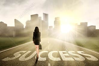 Businesswoman walking to success