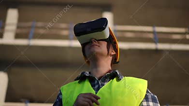 A worker effectively using advanced virtual reality technology on a modern construction site