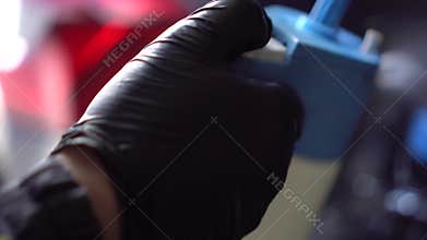 Close-up of interior cleaning in a car. A worker dirty car water blaster with a vacuum cleaner. Car dry cleaning.