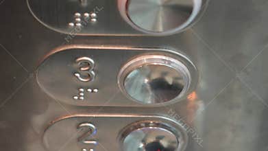 Elevator buttons lighting up in sequence