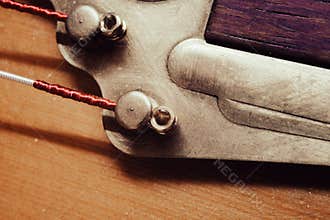 Strings and tailpiece on a Gypsy acoustic guitar