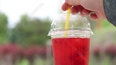 Lemonade in a disposable plastic cup, takeaway drink