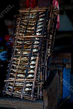 Traditional Smoked Fish in Bamboo Rack