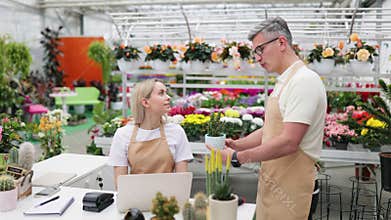 Florist Helping a Customer with a Sale
