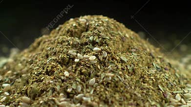 Ground Za\'atar with Sesame Seed Mix Close Up a Middle Eastern Spice Blend with Earthy Green and Brown Tones