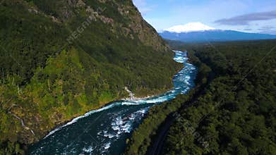Aerial View of a Mountain River with Rapids Flowing through a Forested Gorge