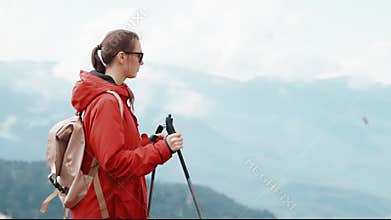 woman backpacking on mount top, admiring beautiful landscapes and enjoying life, healthy lifestyle
