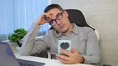 Freelancer Burnout. Tired Man Feeling Sleepy At Workplace In Home Office, Young Male Exhausted After Working Online On