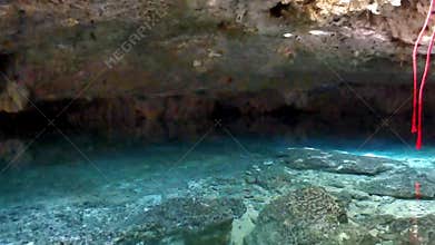 Cenote Park Yaxmuul with limestone rocks turquoise water and rappel