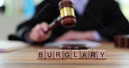 Judge strikes gavel to declare accused guilty of burglary