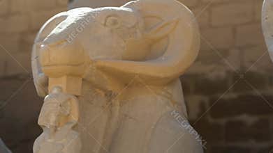 Alley of Egyptian piggies with ram heads in Karnak