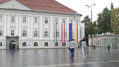 Taking photos of the city hall building (Rathaus) on a cloudy rainy day in Klagenfurt, Austria