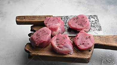 Beautifully cut raw pork medallions for tenderloin meat, waiting to absorb your favorite marinades for a flavorful feast