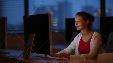 Young female student in a computer classroom