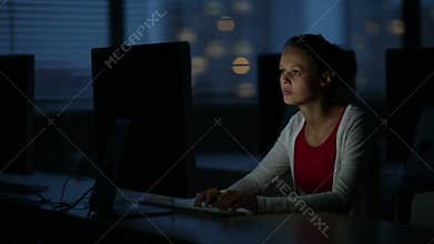 Young female student in a computer classroom