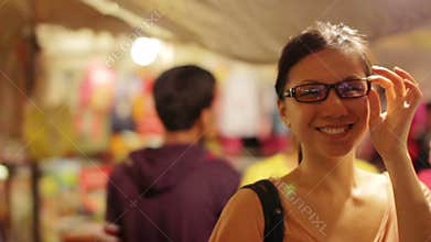Chinese Young Woman Shopping at asian night market