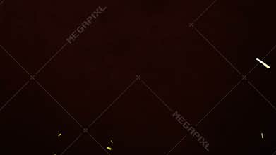 Yellow shapes animating in corners on dark brown background