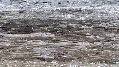 The Frozen Water Surface displays intricate Cracked Ice Patterns that showcase natures beauty