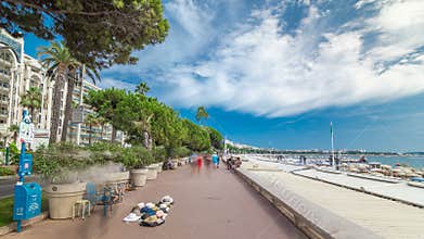 People walking at waterfront near famous La Croisette Boulevard timelapse hyperlapse. French Riviera.