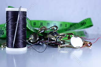 Tailoring Essentials with Needle, Thread and Measuring Tape