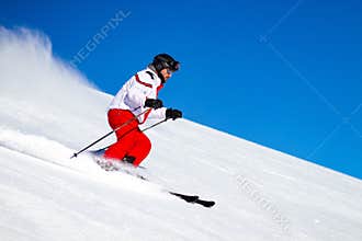 Male Skier Speeding Down Ski Slope