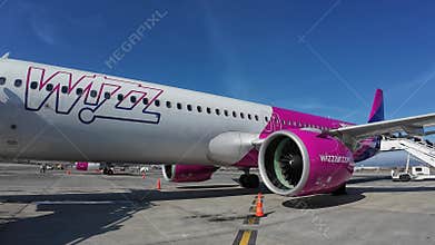 Passengers getting on the Wizz Air Airbus A321 Neo plane in Sofia, Bulgaria on a sunny day