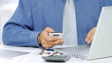 Businessman using mobile phone