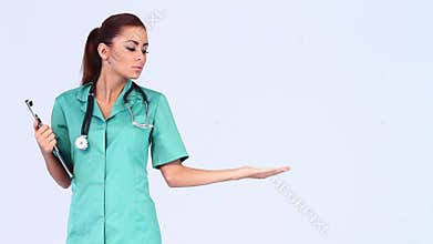 Beautiful female doctor pointing