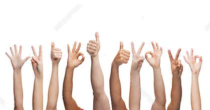 Human hands showing thumbs up, ok and peace signs