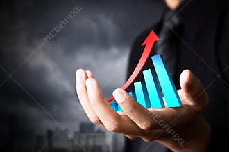 Business man and holding business growth.