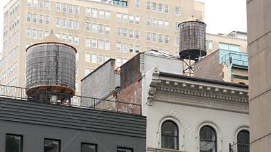 New York City building architecture. Residential house exterior. USA real estate. Rooftop water tower