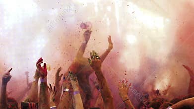 Powder is thrown at holi colour festival in slow motion