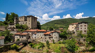 Timelapse clouds on medieval village and castle in tuscany. Italy