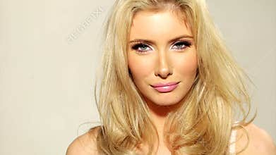 Close up Happy Blond Girl Touching her Hair